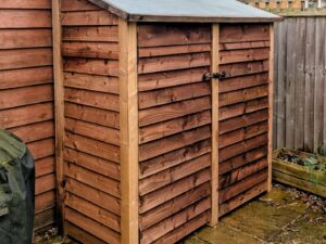 log store with felt roof and closed double doors