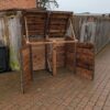 Double wheelie bin storage, brown, open doors and lids.