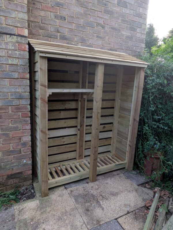 6ft tall 5ft compact log store in light green with shelf