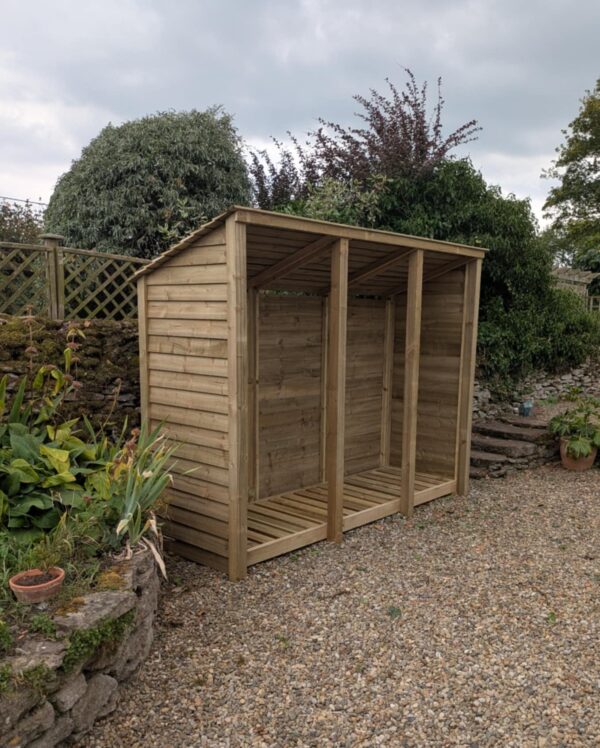 7ft tall 9ft deep log store in light green with reversed roof