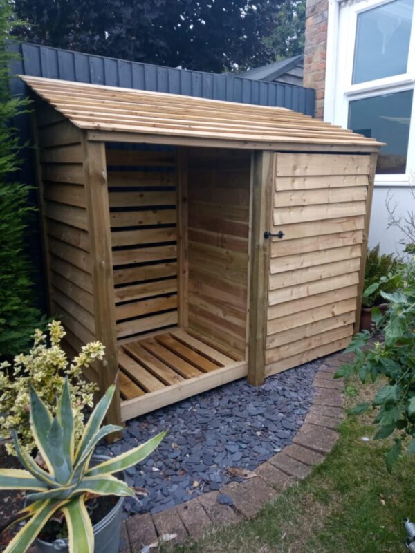 7ft log store Oldham, 6ft tall in light green with partition and door