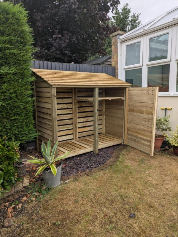 7ft deep log store with 1 bay shelf and single door – green finish