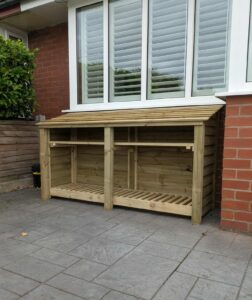 7ft wide log store, 4ft tall with shelf in green finish