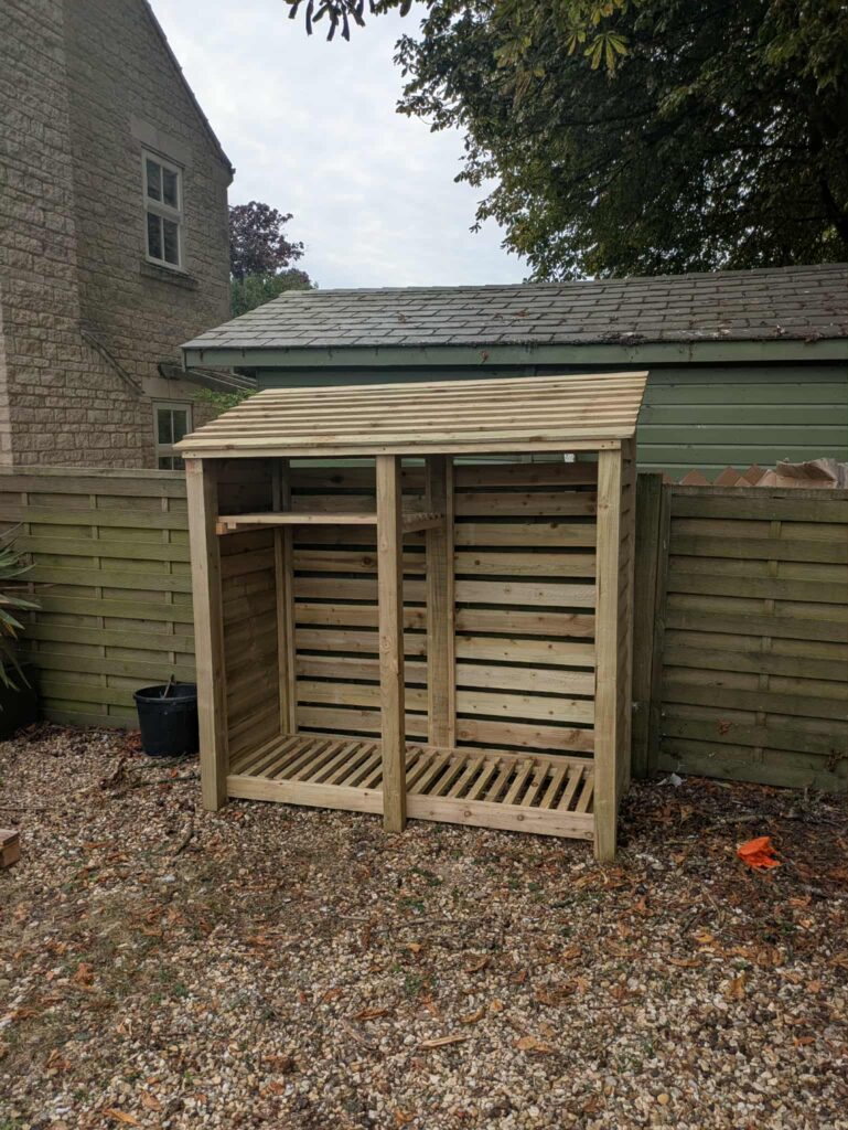 6ft tall log store in light green with one bay shelf