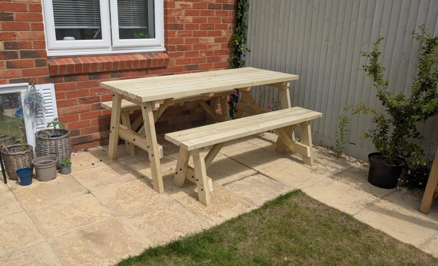 Handmade wooden garden furniture and log stores