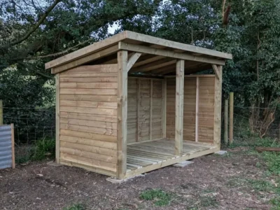 large wooden wood storage shelter for outdoor firewood storage