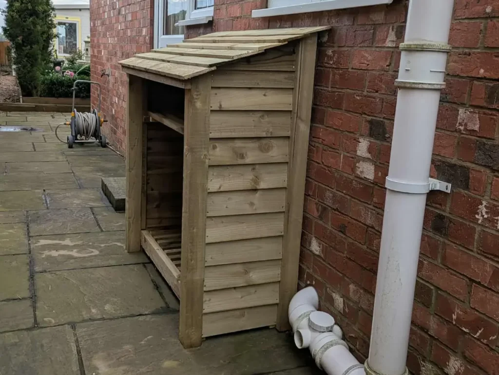 4ft compact log store with shelf green finish